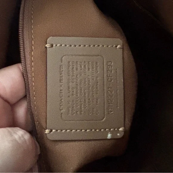 Coach X Peanuts Snoopy Elle File Signature Crossbody Bag with Character patches - Picture 10 of 16